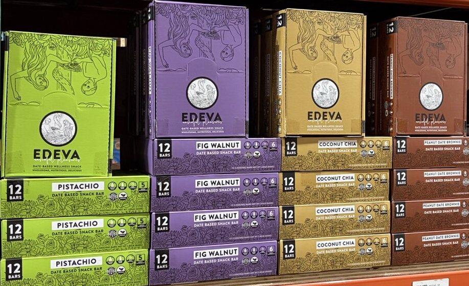 EDEVA bar boxes arranged by flavor on a retail shelf